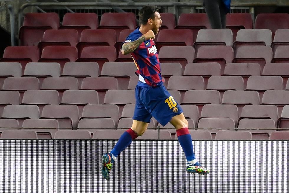 Barcelona's Argentine forward Lionel Messi celebrates after scoring a goal during the UEFA Champions League round of 16 second leg football match between FC Barcelona and Napoli at the Camp Nou stadium in Barcelona on August 8, 2020. (Photo by LLUIS GENE / AFP)