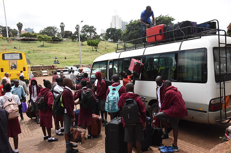 NAIROBI, KENYA - 2020/03/17: Students of Moi High School Kabarak load a mini bus with suitcases at Uhuru Park in Nairobi as they wait to be ferried to their homes following an order by the Kenyan government to suspend learning in all educational institutions as a preventive measure against the spread of Coronavirus. Kenya has since reported four cases of the COVID-19. (Photo by Dennis Sigwe/SOPA Images/LightRocket via Getty Images)