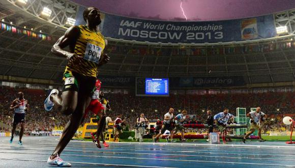 GENIO. Bolt fue un ‘rayo’ bajo la lluvia y con viento en contra. (AFP)