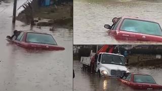 Pasco: Conductor acaba atrapado en auto sumergido por fuertes lluvias | VIDEO