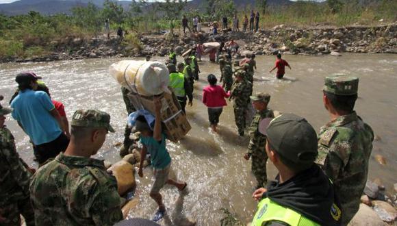 Éxodo. Se estima que más de 5 mil colombianos han huido de Venezuela para no perder sus bienes. (AFP)