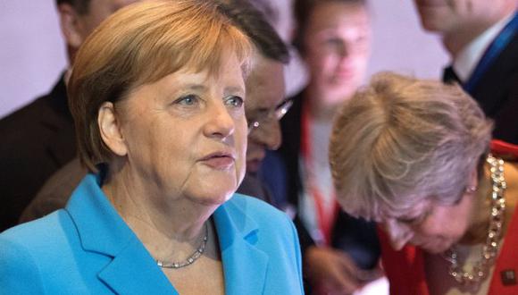 La canciller alemana negó el saludo públicamente a la primera ministra británica. (Foto: EFE)
