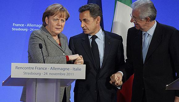 Merkel, Sarkozy y Monti en rueda de prensa posterior a minicumbre. (Reuters)