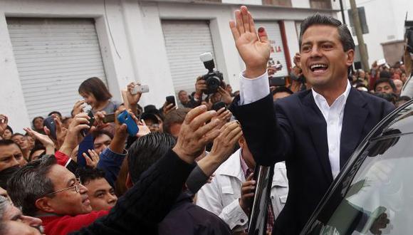 LO HIZO. Peña Nieto, un carismático abogado de 45 años, regirá los destinos de México hasta el 2018. (AP)