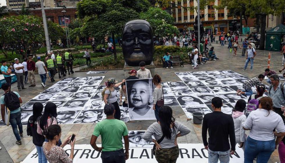 Rostros de migrantes venezolanos hacen un llamado a la solidaridad en Colombia.&nbsp;(Foto: AFP)