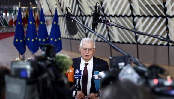 European Union High Representative for Foreign Affairs and Security Policy Josep Borrell talks to the press as he arrives for a Foreign Affairs Council meeting at the EU headquarters in Brussels on February 21, 2022. (Photo by Kenzo TRIBOUILLARD / AFP)