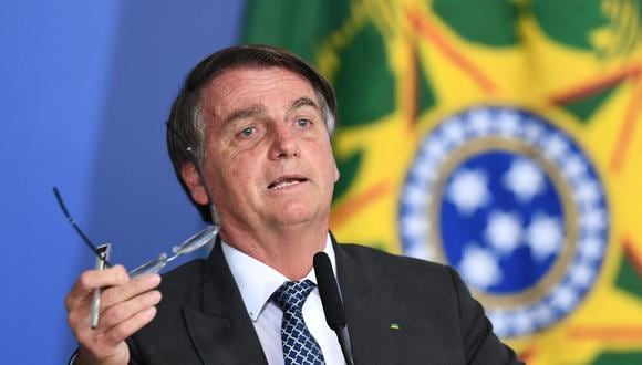 Jair Bolsonaro aseguró que eso no está en los planes del Gobierno y declaró que la crisis sanitaria debe ser “enfrentada”. (Foto: EVARISTO SA / AFP)