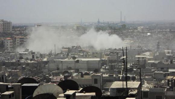 Enfrentamientos en un barrio de Homs. (AP)
