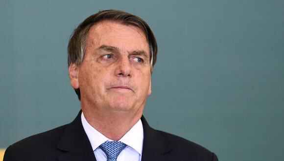 Desde que Jair Bolsonaro asumió el cargo, los indígenas brasileños han presentado tres denuncias contra él ante la CPI por “ecocidio” o “genocidio”. (Foto: EVARISTO SA / AFP)