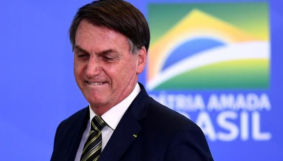 El presidente brasileño, Jair Bolsonaro, es requerido por la justicia de su país para que presente los resultados del examen de coronavirus a la que fue sometido. (Foto: AFP/Evaristo Sa)