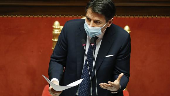 Italian Prime Minister Giuseppe Conte gestures as he replies to questions ahead of a confidence vote at the Senate on January 19, 2021 at Palazzo Madama in Rome. - Italian Prime Minister Giuseppe Conte pleaded for lawmakers' support on January 19, 2021 as his teetering government faced a confidence vote while it struggles to battle the coronavirus pandemic. The ruling coalition has been on the brink of collapse since former premier Matteo Renzi withdrew his Italia Viva party last week, depriving Conte of his majority in the upper chamber. (Photo by Yara NARDI / POOL / AFP)
