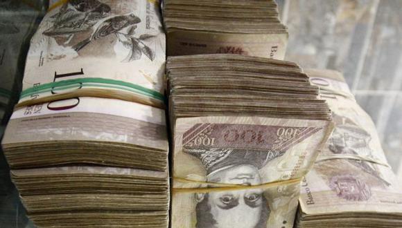 Nicolás Maduro ordenó sacar de circulación el billete más usado y de mayor valor. (AFP)