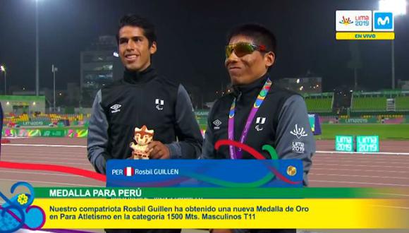 Guillén y su guía celebran el primer oro de Perú en los Parapanamericanos. (Movistar 19)