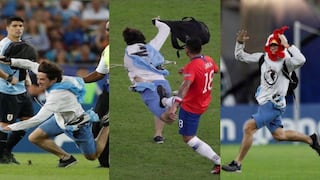 Gonzalo Jara derribó con una patada a hincha que se metió al campo en el duelo Chile vs. Uruguay