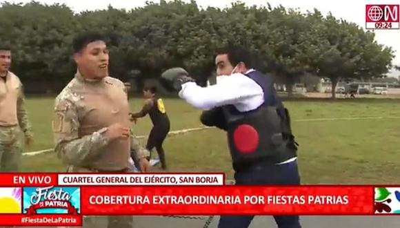 Fernando Llanos, reportero de América TV  y Canal N, tuvo un improvisado encuentro de box con militar. (Foto : Captura)